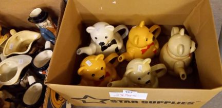 Three boxes of assorted modern pottery Toby Jugs and novelty teapots in the form of teddy bears. (3)
