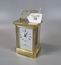 Modern brass carriage clock by Matthew Norman, with key. (B.P. 21% + VAT) The glass panel on the