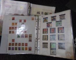 Box with All World collection of stamps in six binders. many 100s of stamps from a wide range of