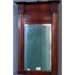 19th century mahogany pier glass with fluted columns under a beaded cornice. Overall 66x36cm approx.