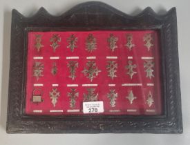 Collection of silver Touareg Niger crosses in ornate leather frame. 33x26cm approx. (B.P. 21% + VAT)