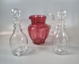 Pair of glass mallet shaped decanters and stoppers, together with a Victorian cranberry glass