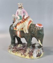 19th century Staffordshire Pottery group of standing Elephant with Mahout and dead Tiger, on