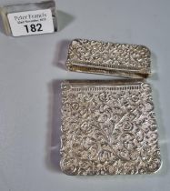 White metal calling card case overall engraved with relief floral and foliate decoration. 3.69