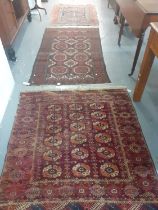 Three Middle Eastern design carpets/runners, overall with geometric and foliate decoration. 113x122,