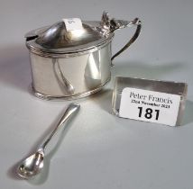 Silver mustard pot with blue glass liner and silver plated spoon. 2.45 troy oz approx. (B.P. 21% +