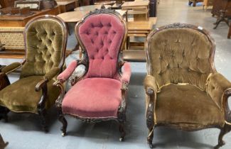 Collection of three late Victorian button back fireside chairs, all with padded arms standing on