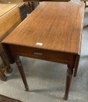 19th century mahogany Pembroke table on ring turned tapering legs and casters. (B.P. 21% + VAT)