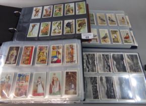 Cigarette cards, collection in four albums, Senior Service, Ogdens, Players, Wills etc. good range
