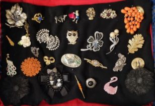 Collection of vintage and other brooches, including : Bakelite orange flower brooch, swan brooch,