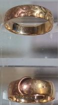 9ct gold buckle ring together with 9ct gold wedding band. 4.4g approx. (B.P. 21% + VAT)