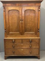 Victorian Welsh pale oak press cupboard, the moulded cornice above two blind panelled doors, and