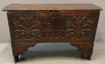 17th century oak plank coffer, of small proportions, the iron and moulded hinged lid above carved