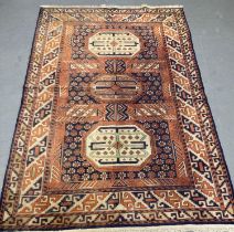 Fine hand woven Caucasian rug with central medallion design and repeating geometric borders.