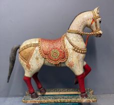 An Indian polychrome hand painted wooden Wedding Horse with foliate decoration, gilded