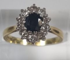 18ct gold sapphire and diamond cluster ring. 4.4g approx. Size N. (B.P. 21% + VAT)