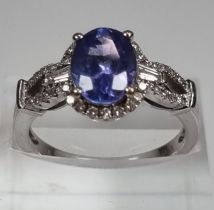 18ct white gold diamond and Tanzanite ring, of oval form. 5g approx. Size O. (B.P. 21% + VAT)