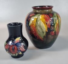 Moorcroft Art Pottery graduated Flambe ground 'Leaf and Berry' design tube lined baluster shaped