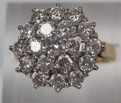 18ct gold multi cluster diamond ring, the stepped decoration set with approximately 20 diamonds. 6.