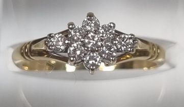 18ct gold nine stone diamond ring of flowerhead form. 2.8g approx. Size L1/2. (B.P. 21% + VAT)