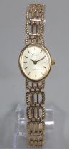 9ct gold Geneve oval ladies bracelet wristwatch with satin face, having baton numerals and bar