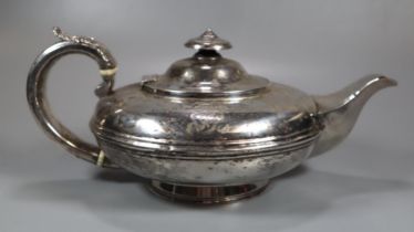 19th century silver bullet shaped teapot with acanthus leaf moulded decoration to the handle,