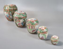Group of five graduated Canton Famille Rose lidded jars and covers of drum/barrel form, decorated