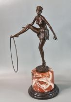 After D Alonzo, an Art Deco style bronze of a semi-nude female dancer with hoop on he outstretched