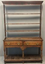 19th century oak two stage pot board dresser, the moulded cornice above an open rack with three