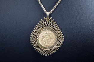George V gold half Sovereign dated 1908 set in a 9ct gold ornate pendant mount with chain. Total