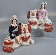 Pair of 19th century Staffordshire Pottery figures of red and white Spaniel type recumbent dogs with