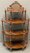 Victorian walnut four tier Whatnot, the mirrored and pierced back above an arrangement of four