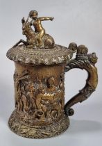 19th century French bronze lidded tankard with pictorial scene of relief moulded cherubs, goat and
