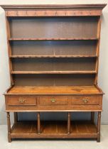 19th century oak two stage pot board dresser, the moulded cornice above iron hooks and three