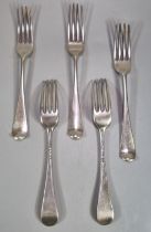 Group of five 18th century Old English design silver dinner forks with varying London hallmarks.