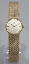 9ct gold ladies bracelet watch, with satin face having baton numerals ans mesh integral Omega