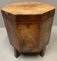 George III mahogany octagonal cellarette, the hinged lid revealing tin lining, brass carrying