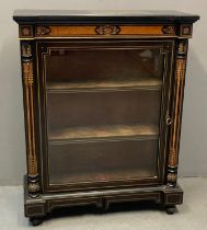 Victorian ebonised pier cabinet, the moulded indented cornice above inlaid marquetry decoration with