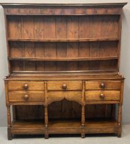 19th century oak two stage pot board dresser, the moulded cornice above boarded rack and fixed