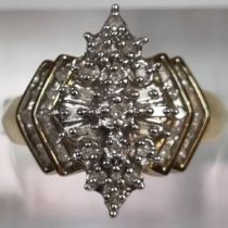 Gold multi cluster diamond ring of stepped lozenge form, the crown shank with stepped diamond