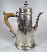 George V silver conical shaped coffee pot with turned wooden handle. Makers initials W E B, London