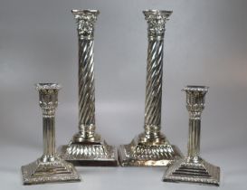 Pair of late 19th century silver candlesticks having relief acanthus leaf decoration, Corinthian