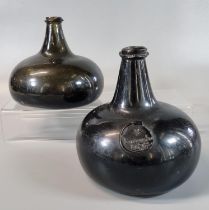 Two 17th century green glass Onion bottles, one with seal marked 'Jurdanston 1698' (sic), believed