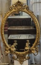 19th century gilt gesso framed oval Girandole mirror with shell and scroll work pediment above egg