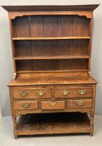 19th century Welsh oak two stage pot board dresser, the moulded cornice above two fitted shelves and