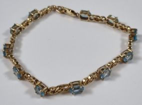 9ct gold blue topaz multi stone bracelet. 11g approx. 20.5cm long approx. . (B.P. 21% + VAT)