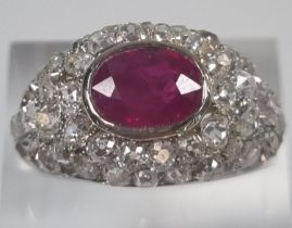 Platinum, ruby and diamond bombe ring. 6.5g approx. Size O 1/2. (B.P. 21% + VAT)