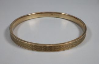 9ct gold textured bangle, Birmingham hallmarks, makers name B & S. 8.5cm diameter. 12.5g approx. (