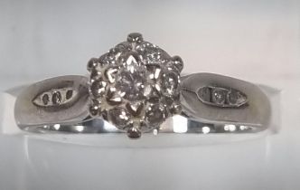 18ct white gold seven stone diamond ring set with a further three diamond chips to each shoulder,
