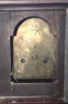 Unusual part 18th century oak long case clock of small proportions, having arched brass face with